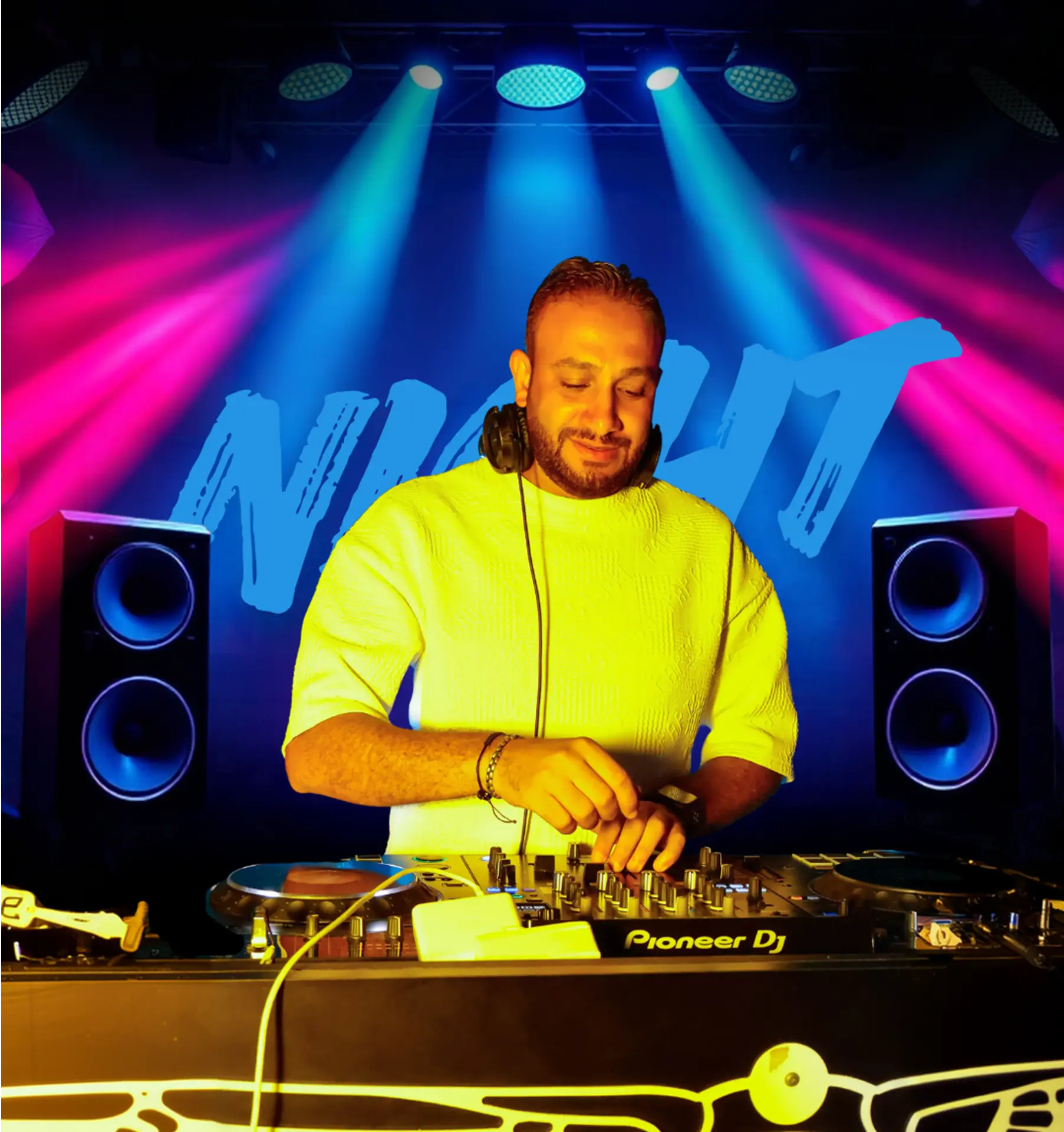 DJ Michael behind the decks under pink and blue stage lights at Chameleon Club Dubai