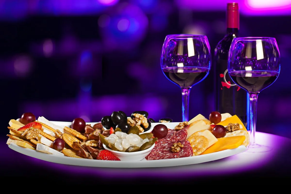 Cheese and charcuterie platter served with red wine