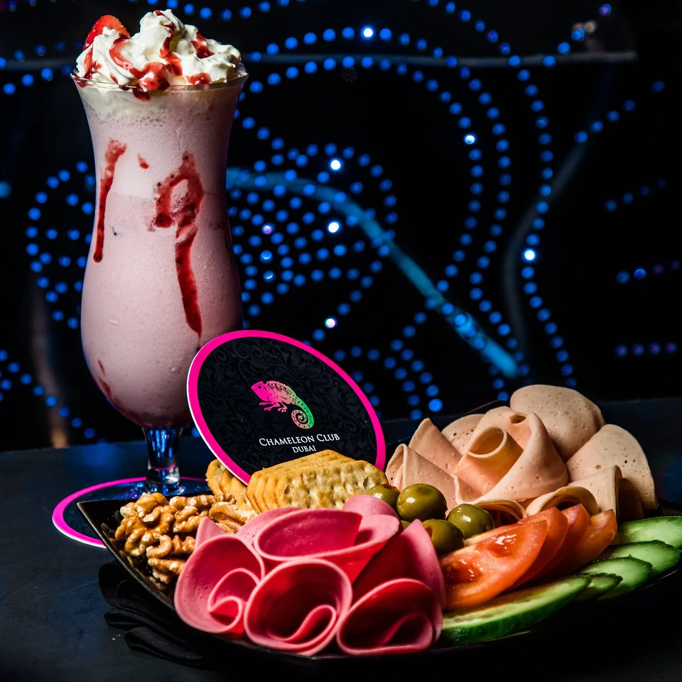 Cold cuts platter served with a berry shake