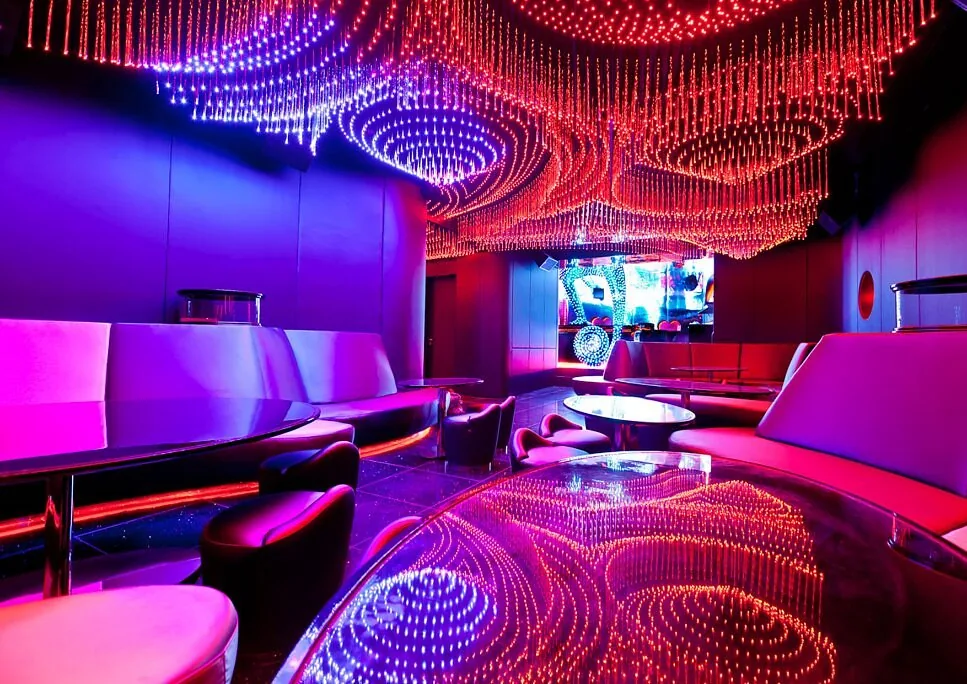 Private Velvet Salon with a cascading red crystal light ceiling and curved booths