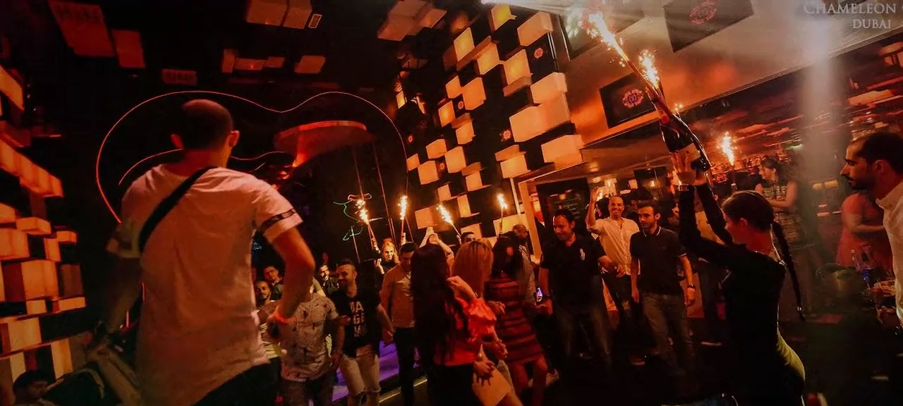 Guests dancing and celebrating at Chameleon Club Dubai